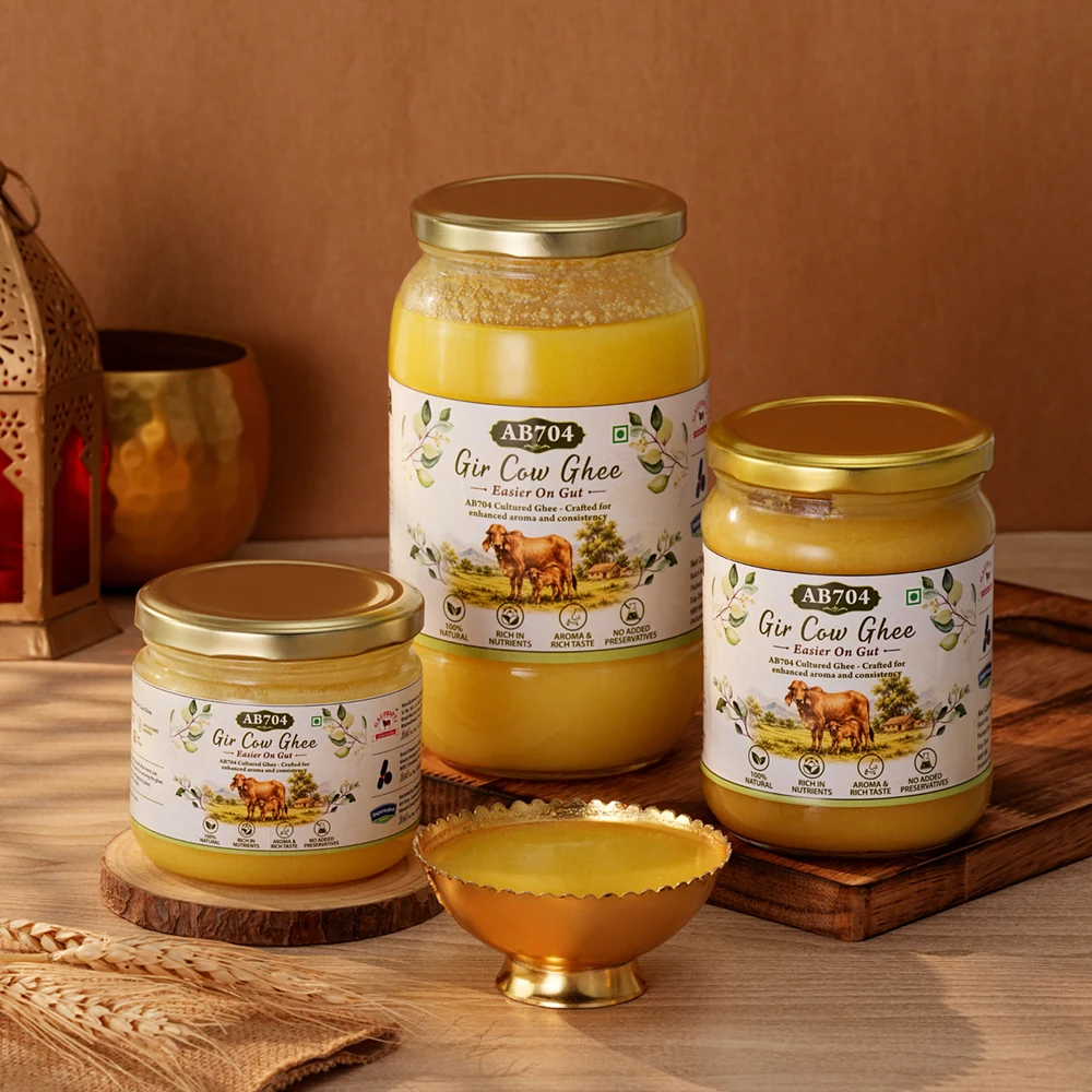 The three sizes of AB704 ghee together on a wooden surface